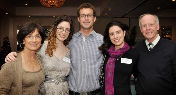 group of professionals smiling for a picture price family