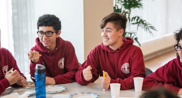 students at a table talking